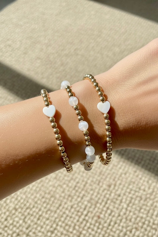 bracelet élastique en perles nacrées et hématites dorées