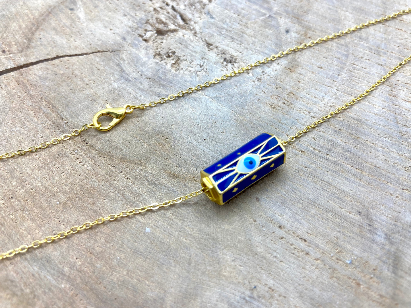 Collier chaîne fine pendentif style porte bonheur bouddhiste