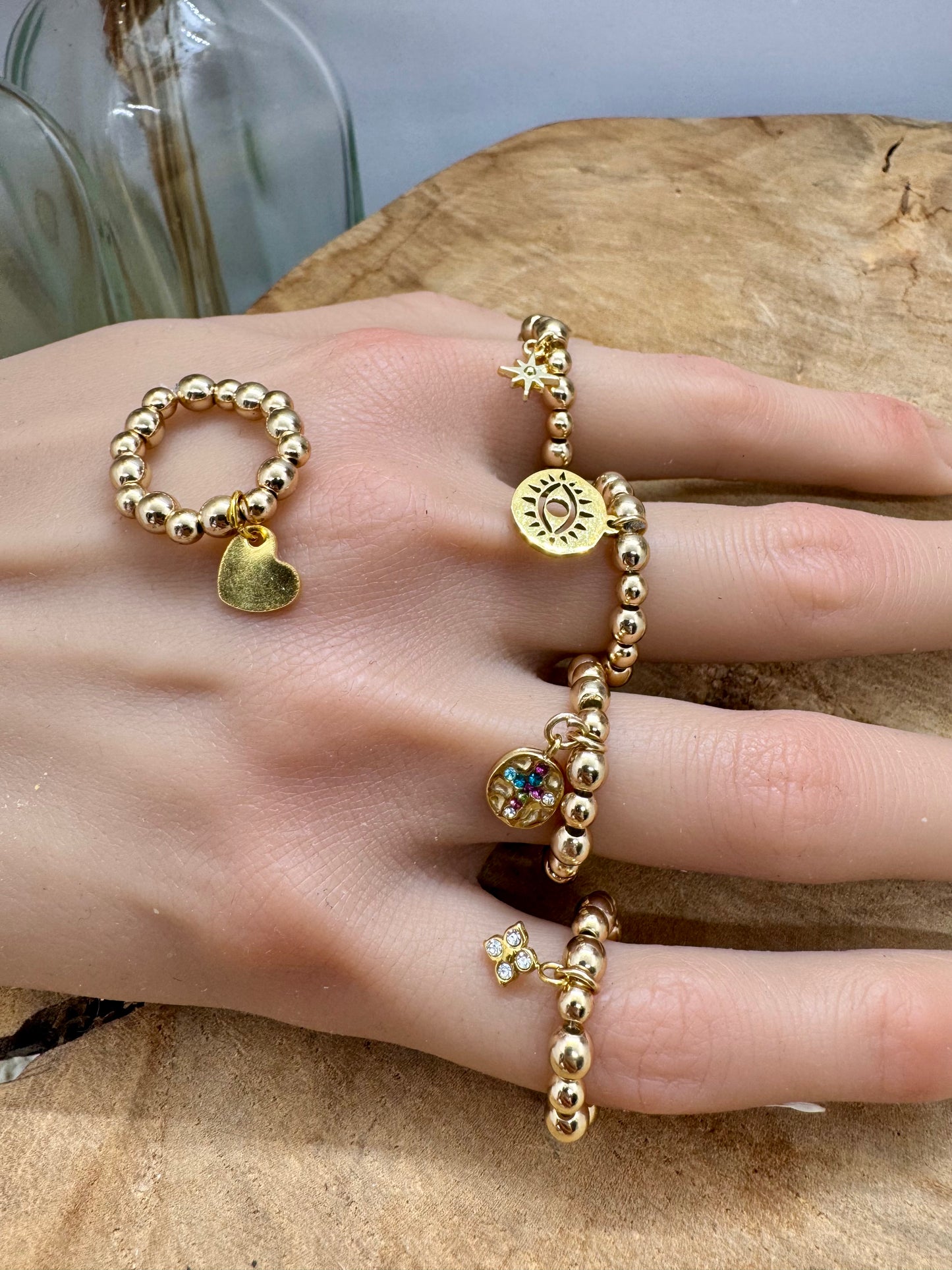 Bague dorée en hématite elastiques tendance – breloque au choix